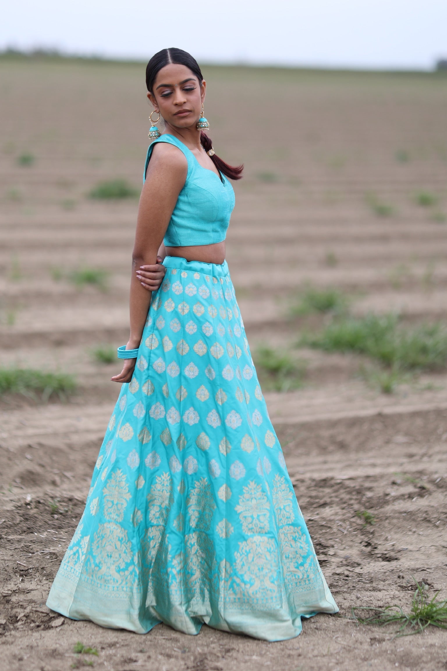 Turquoise Mehndi Net Lehenga Choli